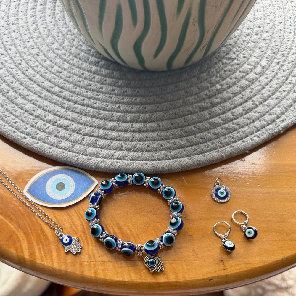 🧿 🪬 bracelet, necklace with two charms. Earrings and sticker.
